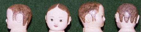 Tiny cloth dolls with handpainted tendril curls